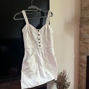 Buttoned, pocketed, off-white, knee length, unworn dress.